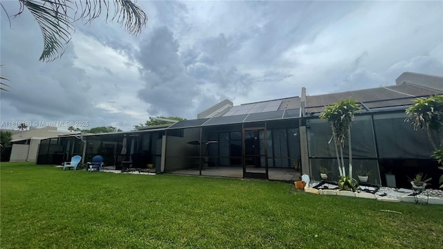 11040 S Lakeview Dr, Pembroke Pines, FL 33026 - back of house with a yard, glass enclosure, and a patio