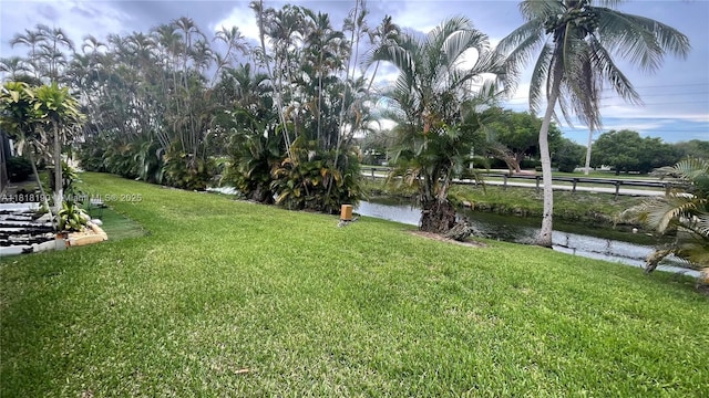 11040 S Lakeview Dr, Pembroke Pines, FL 33026 - view of green lawn featuring a water view