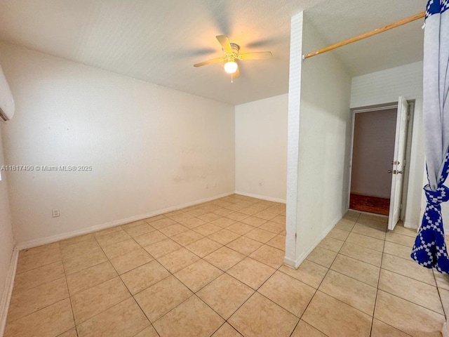 1021 NW 3rd St Unit 206, Miami, FL 33128 - empty room featuring light tile patterned floors, a ceiling fan, and baseboards