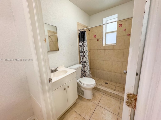 1021 NW 3rd St Unit 206, Miami, FL 33128 - bathroom with toilet, a textured wall, vanity, tiled shower, and tile patterned floors