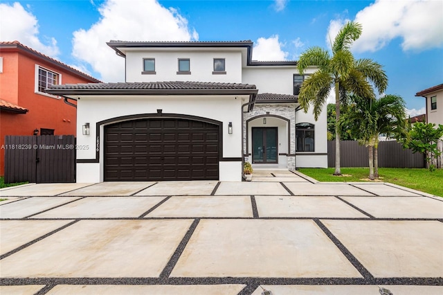 18250 SW 152nd Ave, Miami, FL 33187 - mediterranean / spanish-style house featuring stucco siding, driveway, french doors, a tiled roof, and a garage