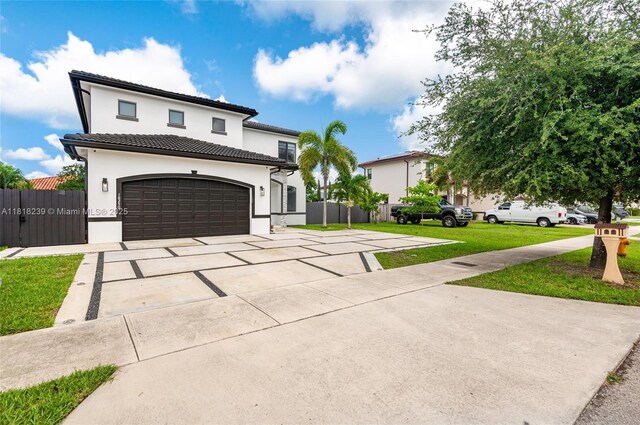 18250 SW 152nd Ave, Miami, FL 33187 - mediterranean / spanish house featuring driveway, stucco siding, and a tiled roof