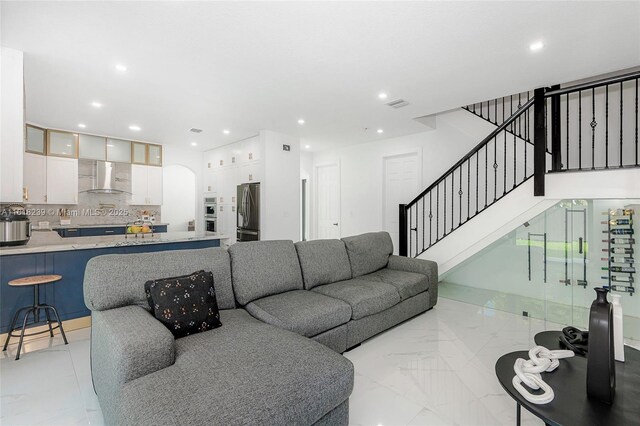 18250 SW 152nd Ave, Miami, FL 33187 - living area featuring recessed lighting, stairway, and arched walkways