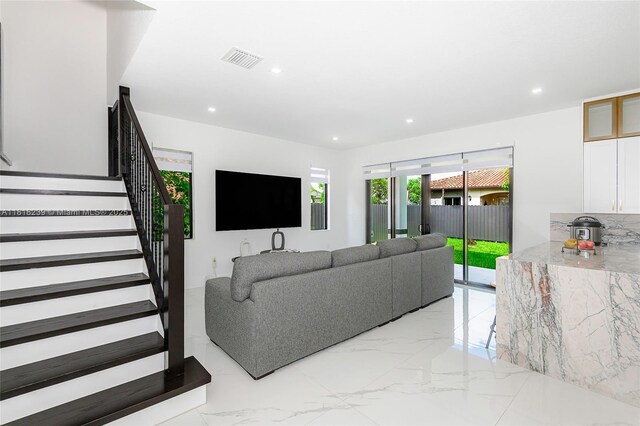 18250 SW 152nd Ave, Miami, FL 33187 - living room featuring light marble finish floors, recessed lighting, and stairway