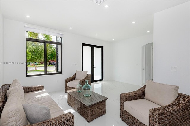 18250 SW 152nd Ave, Miami, FL 33187 - living room with marble tiled floors, recessed lighting, and arched walkways