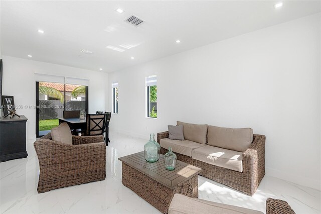 18250 SW 152nd Ave, Miami, FL 33187 - living area with recessed lighting, marble finish flooring, and baseboards