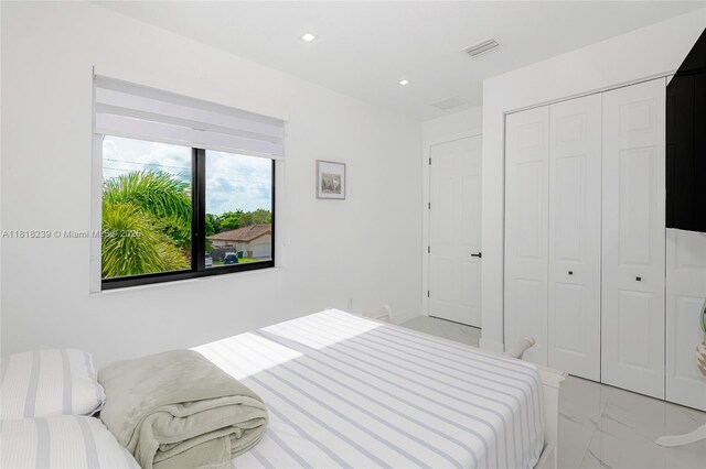 18250 SW 152nd Ave, Miami, FL 33187 - bedroom with light marble finish flooring, a closet, and recessed lighting
