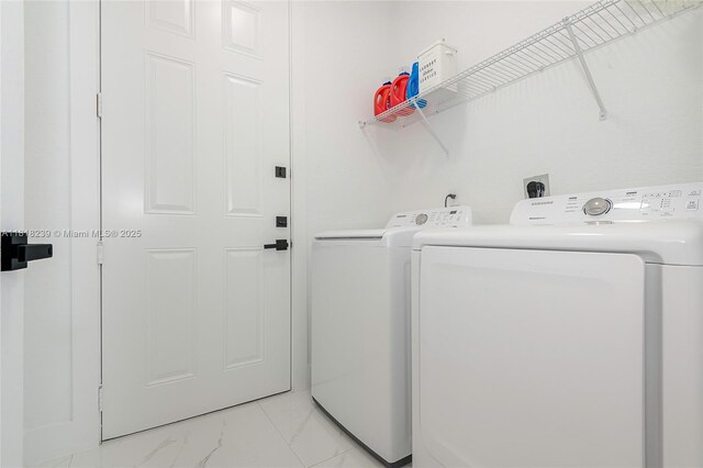 18250 SW 152nd Ave, Miami, FL 33187 - washroom featuring washing machine and dryer and light marble finish floors