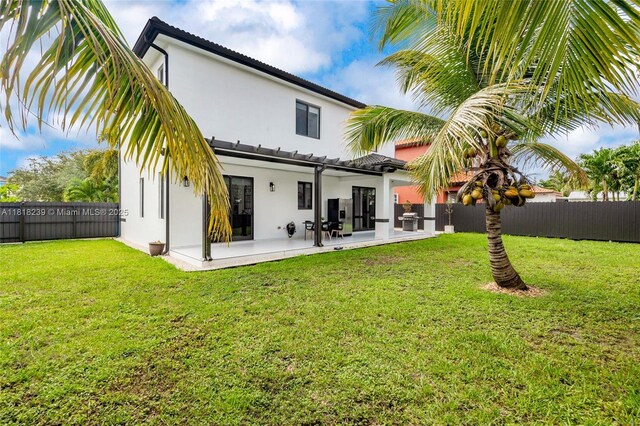 18250 SW 152nd Ave, Miami, FL 33187 - rear view of property featuring stucco siding and a patio area