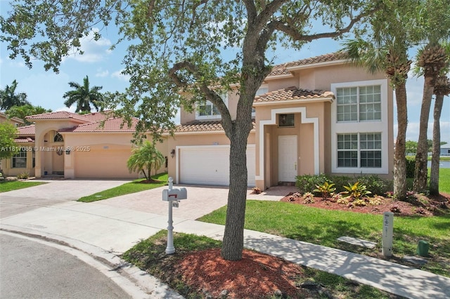 16710 NW 12th St, Pembroke Pines, FL 33028 - mediterranean / spanish home with driveway, a tile roof, and stucco siding