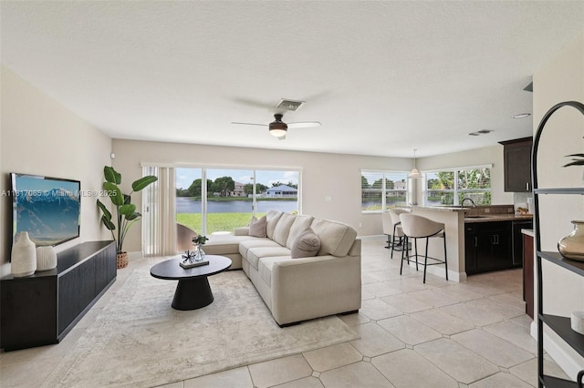16710 NW 12th St, Pembroke Pines, FL 33028 - living room with a water view and a ceiling fan