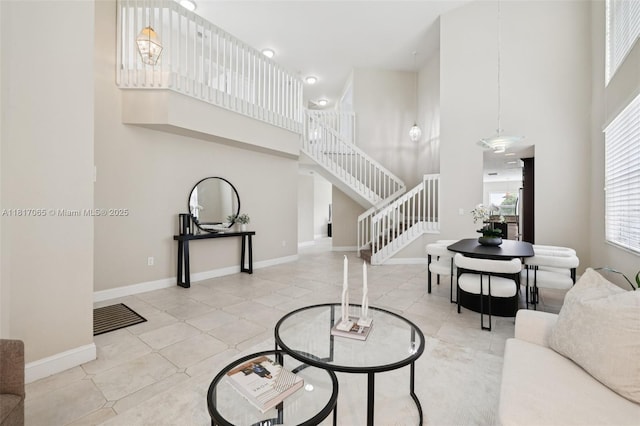 16710 NW 12th St, Pembroke Pines, FL 33028 - tiled living area featuring a towering ceiling and stairs
