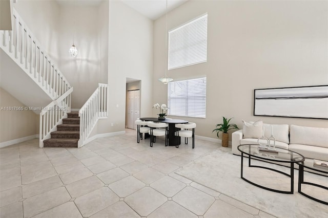 16710 NW 12th St, Pembroke Pines, FL 33028 - living room with stairway, a high ceiling, and tile patterned flooring
