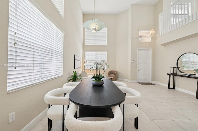 16710 NW 12th St, Pembroke Pines, FL 33028 - dining area featuring a high ceiling and baseboards
