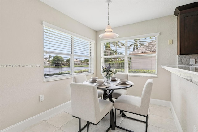 16710 NW 12th St, Pembroke Pines, FL 33028 - dining space featuring healthy amount of natural light, light tile patterned floors, and a water view