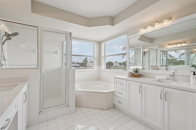 16710 NW 12th St, Pembroke Pines, FL 33028 - bathroom with two vanities, a shower stall, a garden tub, and tile patterned flooring