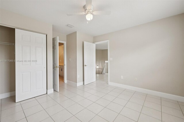 16710 NW 12th St, Pembroke Pines, FL 33028 - unfurnished bedroom featuring a closet, light tile patterned floors, and ceiling fan