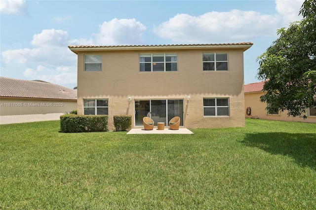 16710 NW 12th St, Pembroke Pines, FL 33028 - rear view of property with stucco siding, a lawn, and a patio