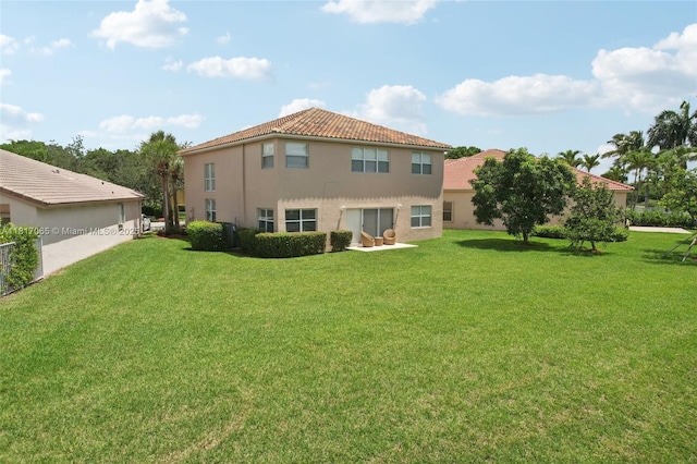 16710 NW 12th St, Pembroke Pines, FL 33028 - rear view of house with a yard, stucco siding, and a tiled roof