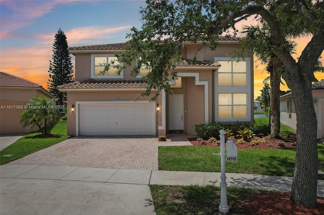 16710 NW 12th St, Pembroke Pines, FL 33028 - mediterranean / spanish-style house with decorative driveway, a tiled roof, and stucco siding