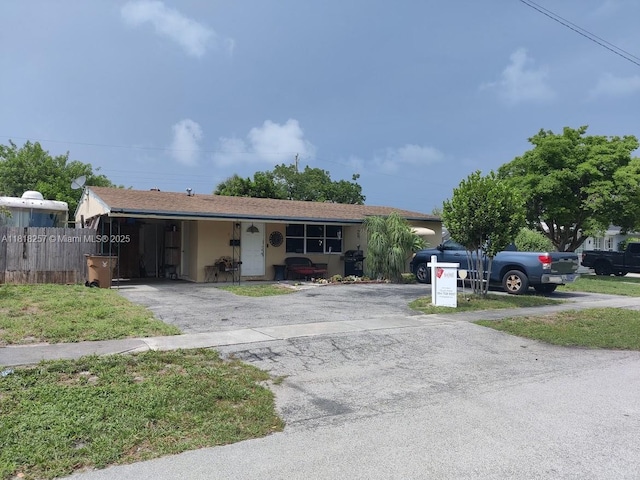 401 SE 4th St, Deerfield Beach, FL 33441 - ranch-style house with asphalt driveway and stucco siding