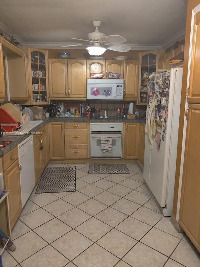401 SE 4th St, Deerfield Beach, FL 33441 - kitchen with white appliances, crown molding, glass insert cabinets, a ceiling fan, and dark countertops