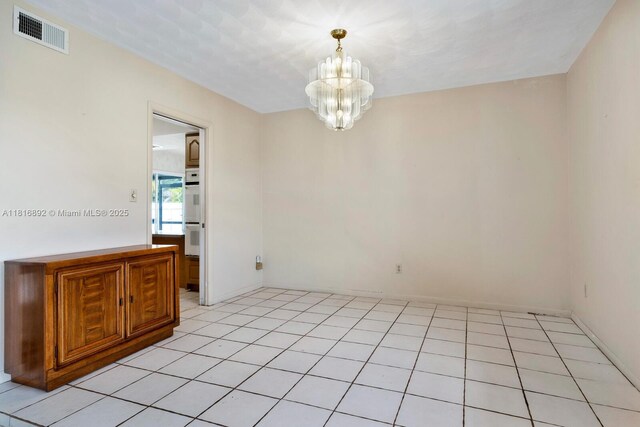 8980 SW 59th St, Miami, FL 33173 - spare room with a chandelier and light tile patterned floors