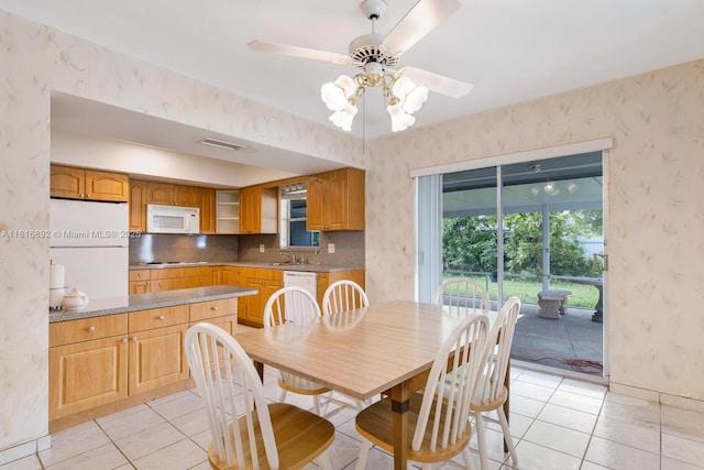 8980 SW 59th St, Miami, FL 33173 - dining area with light tile patterned floors, wallpapered walls, and ceiling fan
