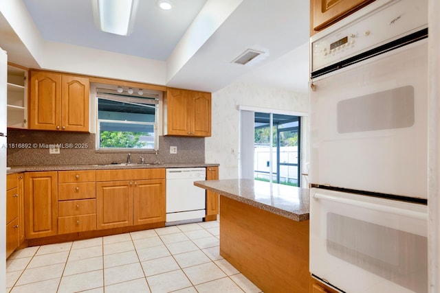 8980 SW 59th St, Miami, FL 33173 - kitchen featuring white appliances, light stone counters, tasteful backsplash, and light tile patterned floors