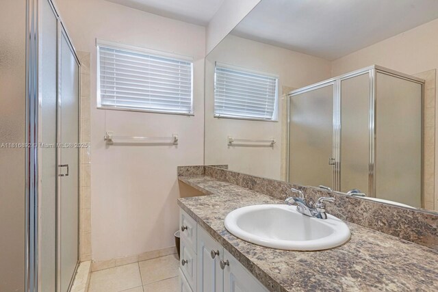 8980 SW 59th St, Miami, FL 33173 - full bathroom with vanity, a stall shower, and tile patterned flooring