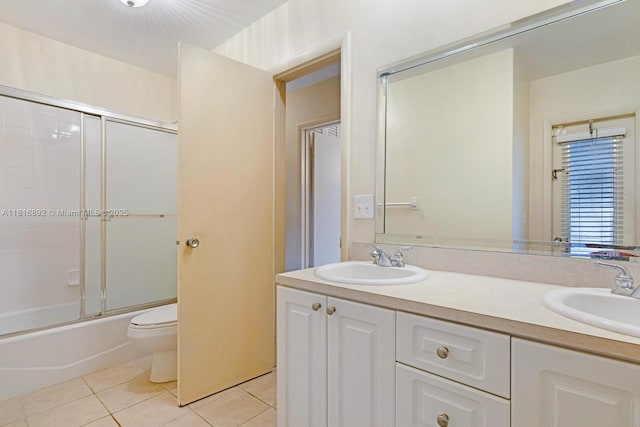 8980 SW 59th St, Miami, FL 33173 - bathroom featuring tile patterned floors, double vanity, and bath / shower combo with glass door