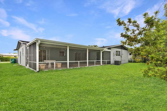 8980 SW 59th St, Miami, FL 33173 - rear view of property with a sunroom and a yard