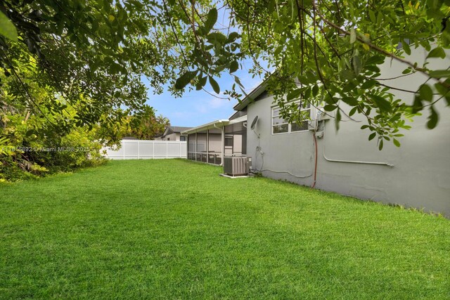 8980 SW 59th St, Miami, FL 33173 - fenced backyard featuring a sunroom