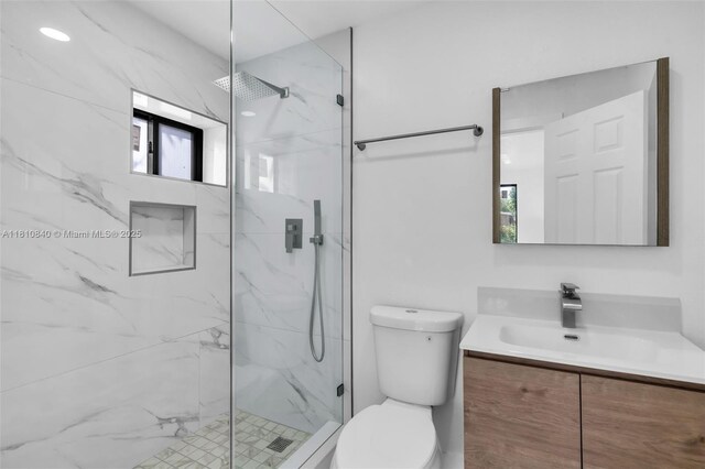 1010 NE 140th St, North Miami, FL 33161 - bathroom with vanity, toilet, and a marble finish shower