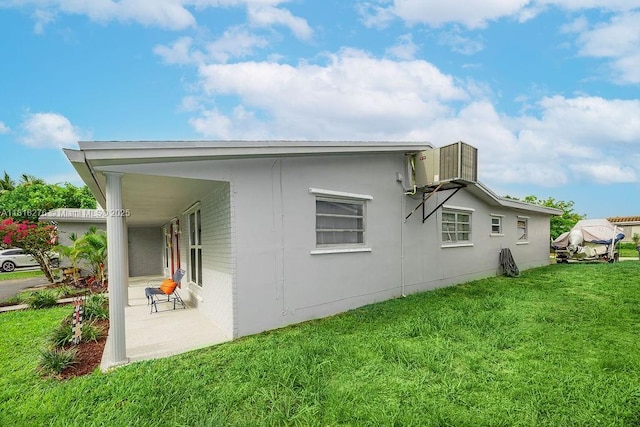 1801 N 55th Ave, Hollywood, FL 33021 - view of side of property featuring a lawn and central AC unit