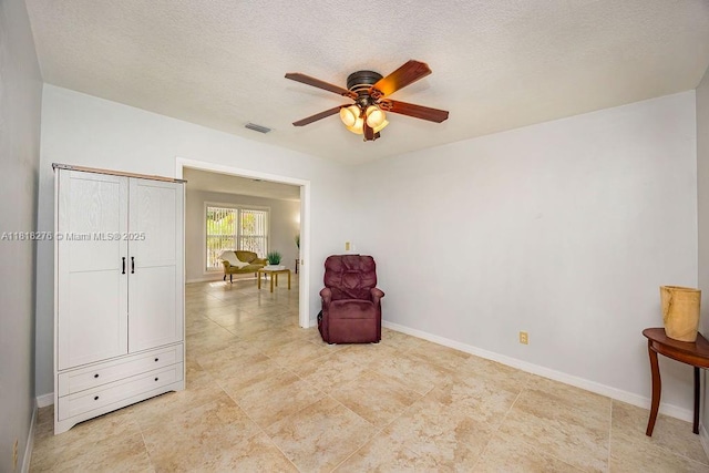 1801 N 55th Ave, Hollywood, FL 33021 - sitting room with a ceiling fan, baseboards, and a textured ceiling