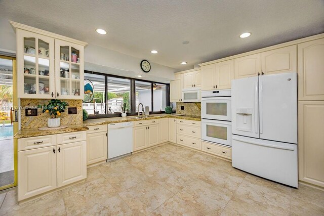 1801 N 55th Ave, Hollywood, FL 33021 - kitchen featuring white appliances, a sink, tasteful backsplash, glass insert cabinets, and recessed lighting