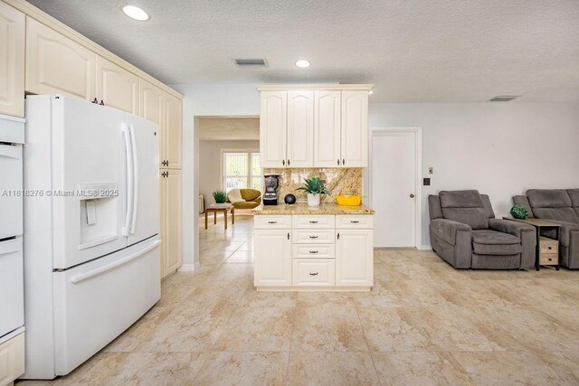 1801 N 55th Ave, Hollywood, FL 33021 - kitchen with white refrigerator with ice dispenser, open floor plan, light stone counters, decorative backsplash, and recessed lighting