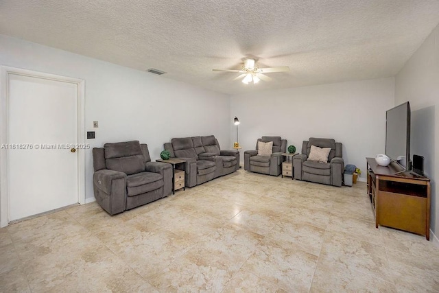 1801 N 55th Ave, Hollywood, FL 33021 - living room featuring a ceiling fan and a textured ceiling