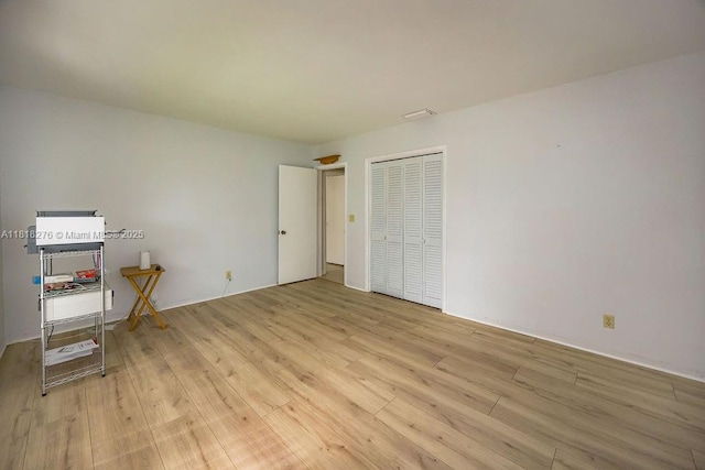 1801 N 55th Ave, Hollywood, FL 33021 - unfurnished bedroom featuring light wood-style floors and a closet