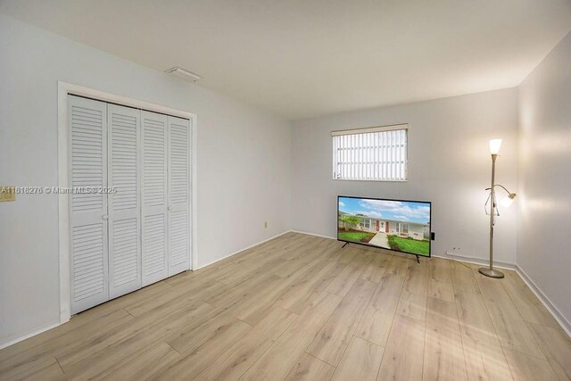 1801 N 55th Ave, Hollywood, FL 33021 - unfurnished living room featuring light wood-type flooring