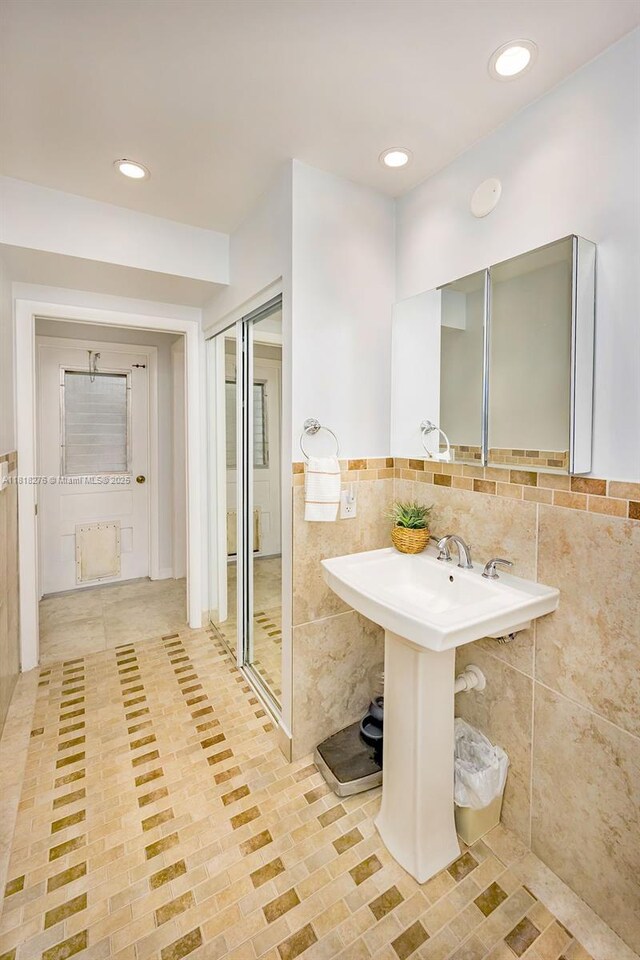 1801 N 55th Ave, Hollywood, FL 33021 - bathroom with tile walls, tile patterned flooring, recessed lighting, and a wainscoted wall