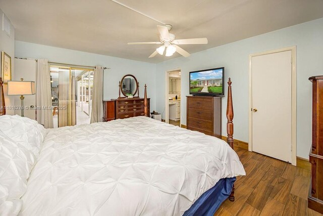 1801 N 55th Ave, Hollywood, FL 33021 - bedroom featuring wood finished floors, access to outside, a ceiling fan, ensuite bathroom, and baseboards