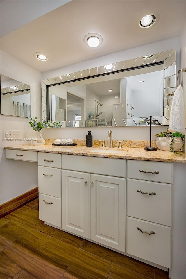1801 N 55th Ave, Hollywood, FL 33021 - bathroom with vanity, wood finished floors, a shower, and baseboards