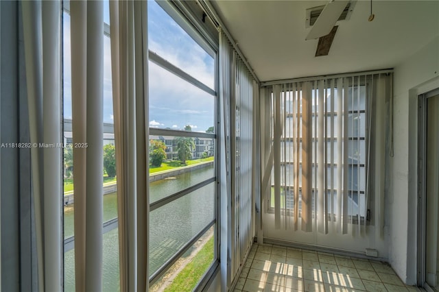8350 Sands Point Blvd Unit E309, Tamarac, FL 33321 - unfurnished sunroom featuring a water view