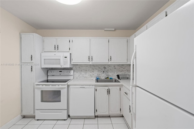 8350 Sands Point Blvd Unit E309, Tamarac, FL 33321 - kitchen featuring white appliances, light tile patterned flooring, light countertops, and white cabinets