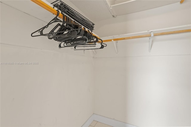 8350 Sands Point Blvd Unit E309, Tamarac, FL 33321 - walk in closet with light tile patterned floors