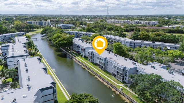 8350 Sands Point Blvd Unit E309, Tamarac, FL 33321 - aerial view of a large body of water and a tree filled landscape