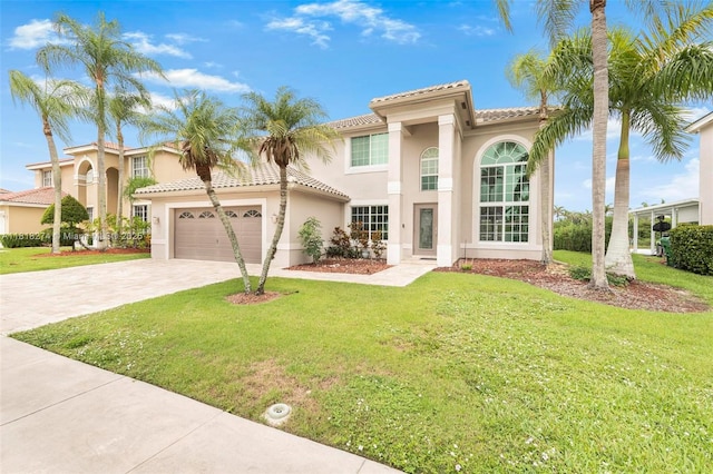 2256 SW 183rd Ter, Miramar, FL 33029 - mediterranean / spanish-style home with driveway, a tiled roof, a front lawn, and a garage