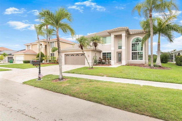 2256 SW 183rd Ter, Miramar, FL 33029 - mediterranean / spanish-style house with a tile roof, driveway, stucco siding, an attached garage, and a front lawn